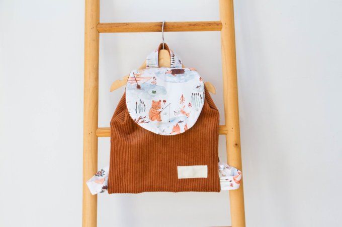 Cartable velour marron ous qui peche en stock  